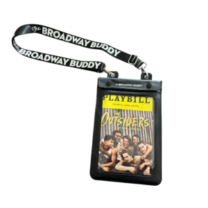 A Broadway Buddy containing a Playbill for "The Outsiders," featuring a stylish black strap with The Broadway Buddy logo.