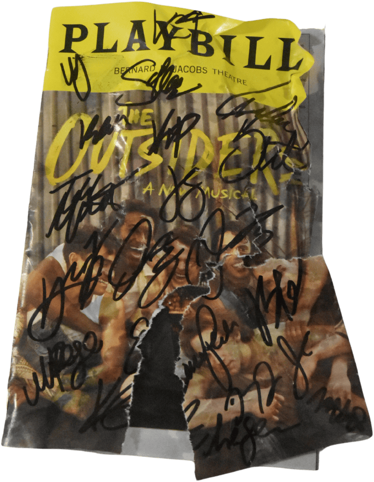 A crumpled Playbill for "The Outsider: A New Musical," heavily marked with multiple autographs.